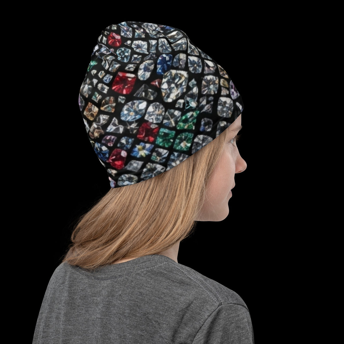 Street Culture neck gaiter worn as a beanie featuring a colorful diamond mosaic print on a black background