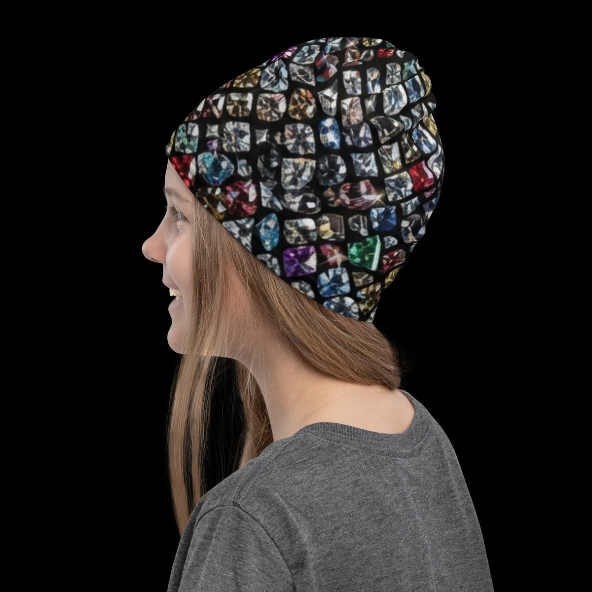 Street Culture neck gaiter worn as a beanie featuring a colorful gemstone mosaic print on a black background