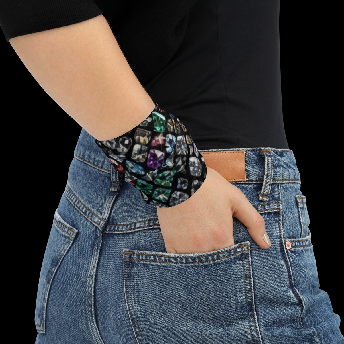 Street Culture neck gaiter with a colorful gemstone print worn as a stylish wristband with blue jeans