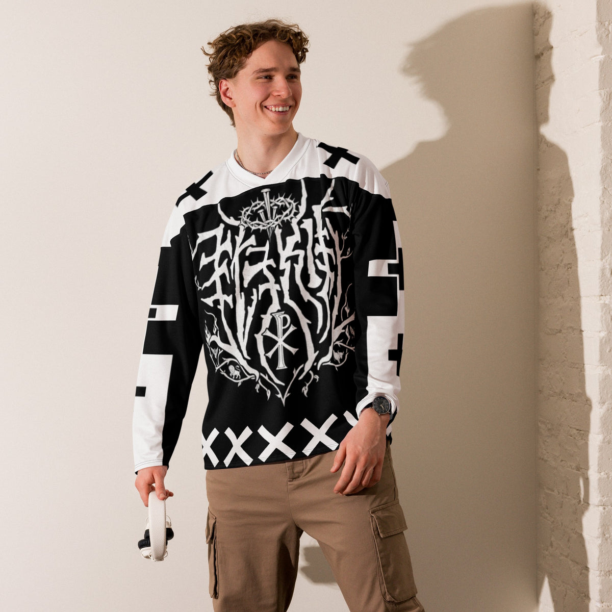 Street Culture recycled hockey jersey in black and white with graphic print, v-neck, and relaxed fit on a male model.