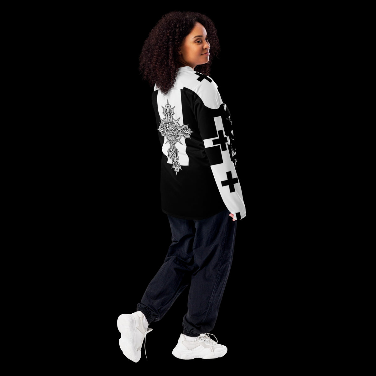 Street Culture recycled hockey jersey in black and white with gothic cross print, worn by a woman looking back.