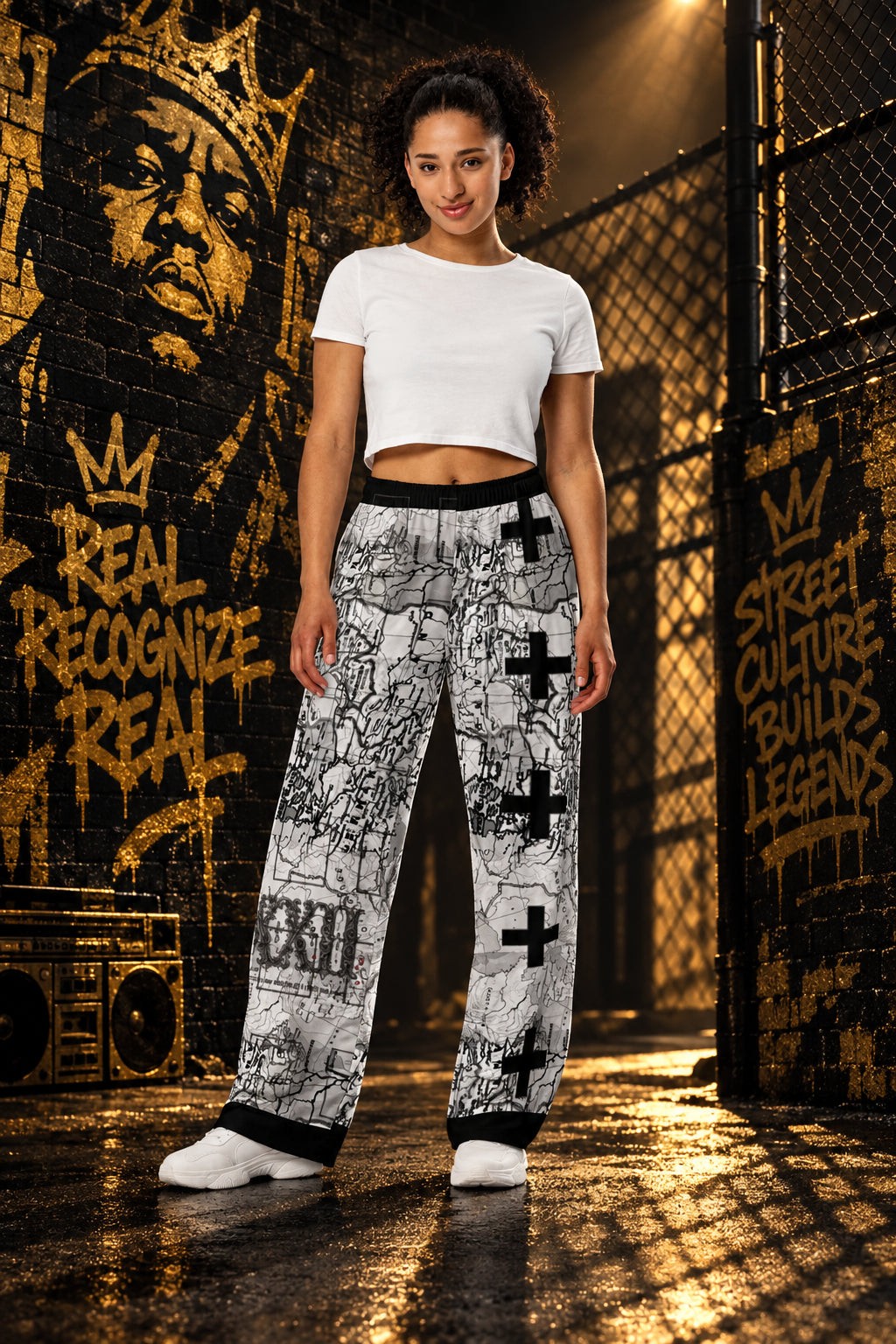Street Culture unisex wide-leg pants with black and white all-over graphic print, elastic waist, and side pockets.